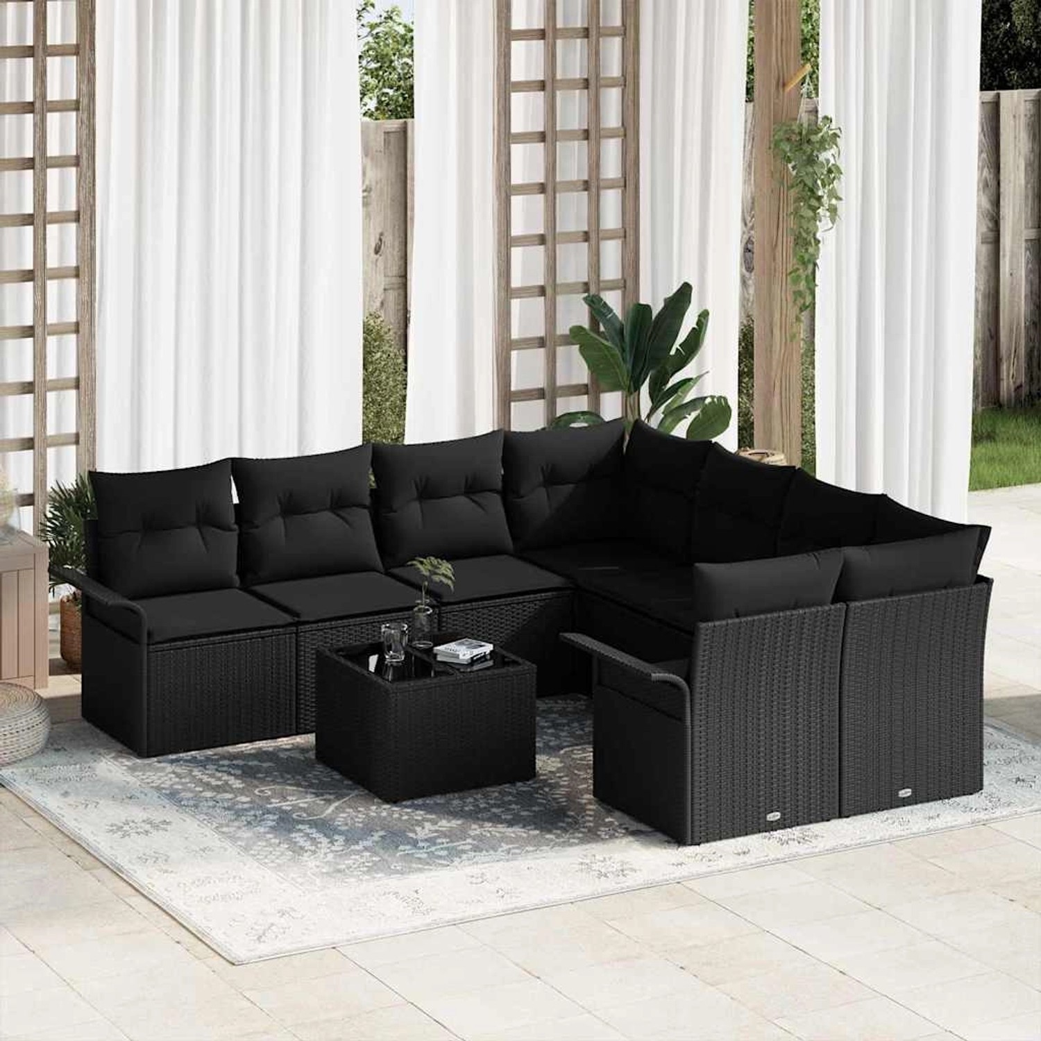 Schwarzes 9-teiliges vidaXL Garten-Sofa-Set aus Poly Rattan mit Tisch für Terrasse und Garten.