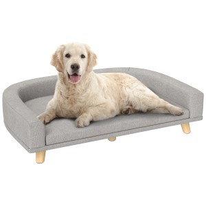 Graues PawHut Hundebett/Hundesofa aus Polyester und MDF mit hellem Hund darauf.