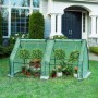 Grünes WOLTU Foliengewächshaus 180x90x90cm mit Metallrahmen und Fenstern, gefüllt mit Pflanzen im Garten.