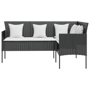 Schwarzes L-förmiges Rattan Sofa mit weißen Kissen für den Garten.
