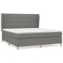 Boxspringbett dunkelgrau 180x200 cm mit Stoffbezug und Matratze.
