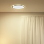Schwarze WiZ LED Deckenleuchte SuperSlim, tunable white, 2450 lm, Ø 43 cm an Zimmerdecke.