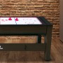 Spieltisch Reverso als Airhockey-Tisch mit roten Pucks und Holzausstrahlung.