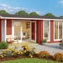 Rotes Lasita Holz-Gartenhaus Brighton mit Satteldach, lasiert, Glasfenstern und Terrasse im Garten.