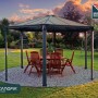 Canopia Gartenpavillon Monaco 3.9 x 4.5 m in Anthrazit mit Tisch und Stühlen.