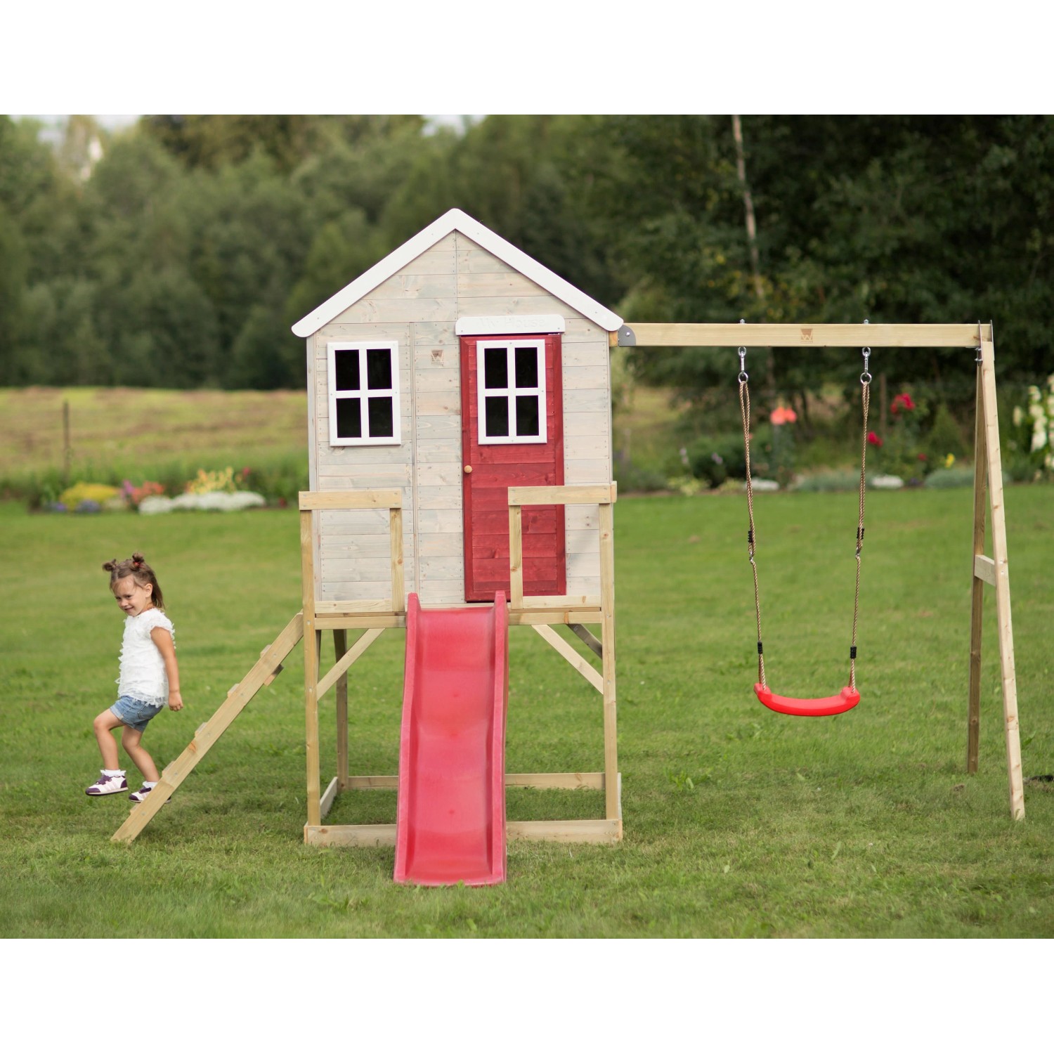 Wendi Toys Kinderspielhaus Elefant mit Rutsche und Schaukel im Garten.