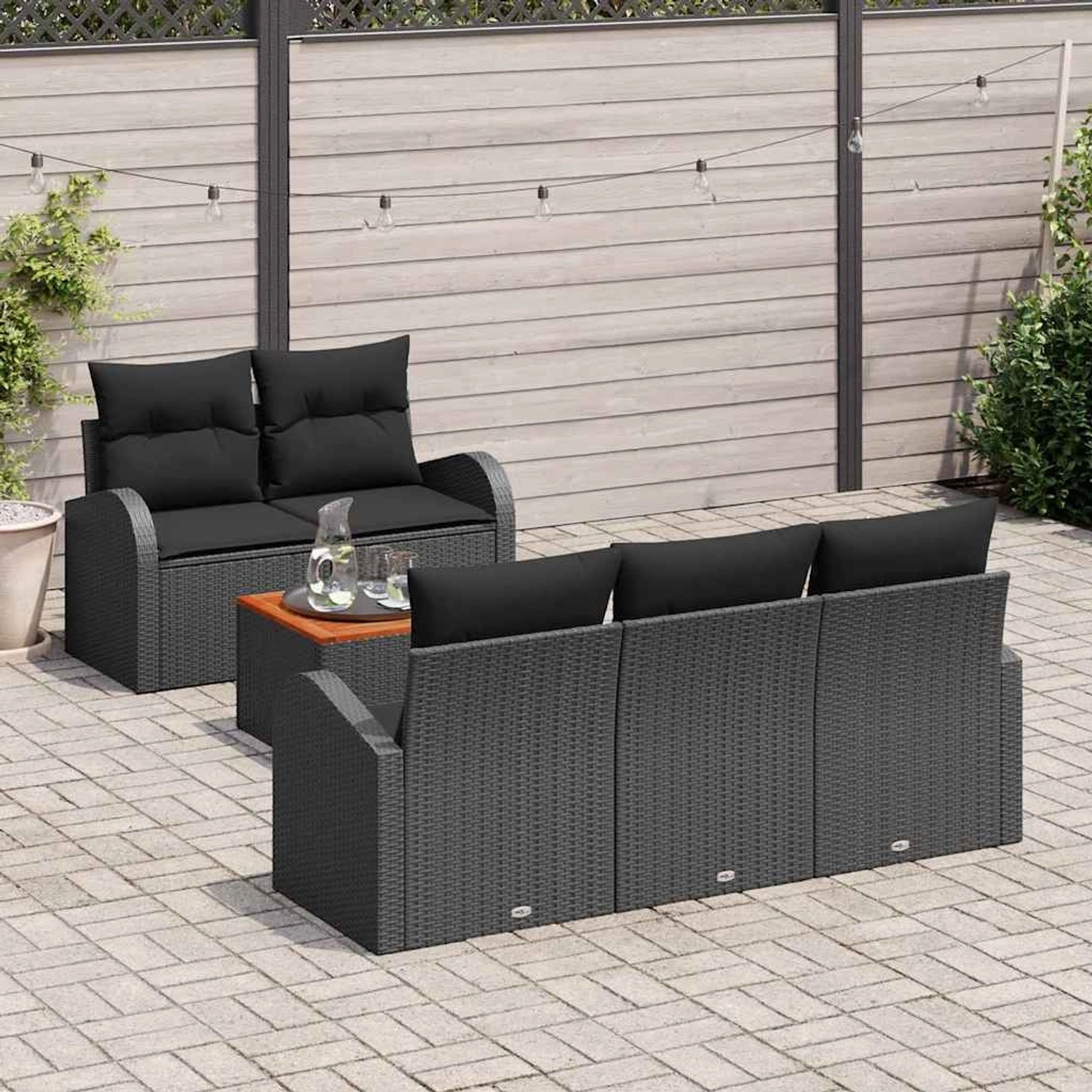 Schwarzes 6-teiliges vidaXL Garten-Sofa-Set aus Polyrattan mit Tisch und modularem Design.