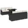 Schwarzes 7-teiliges Garten-Sofa-Set aus Polyrattan mit Tisch und Kissen.