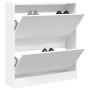 Weißer Schuhschrank mit 2 offenen Klappfächern aus Holzwerkstoff, Schuhe sichtbar. Kompakter Schuhkipper für Flur.