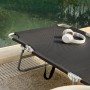 Schwarze SoBuy Gartenliege OGS35-SCH mit Kopfhörern, klappbar und mit Seitentasche.