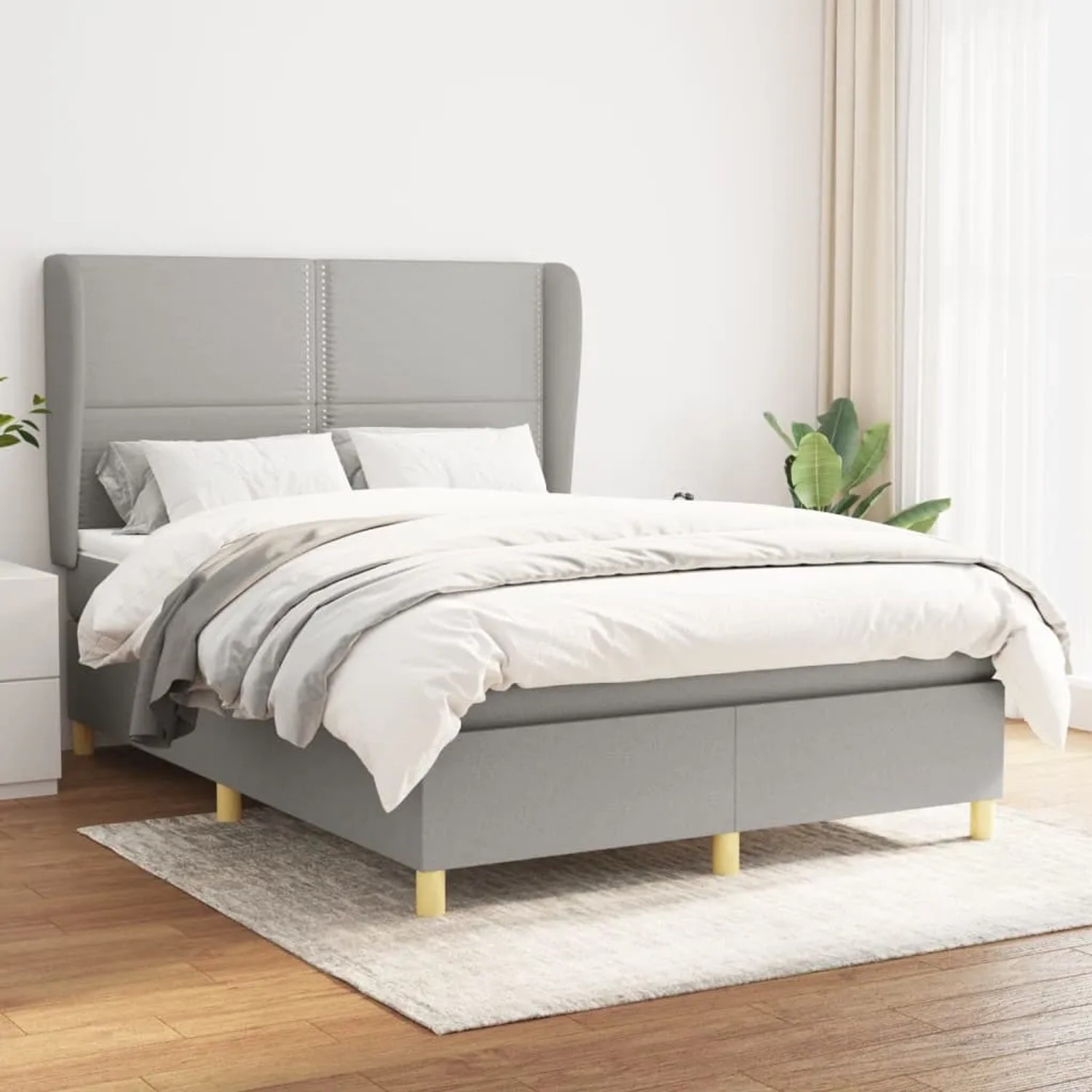 Hellgraues vidaXL Boxspringbett 140x190 cm mit Matratze und Stoffbezug.