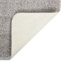Hellgrauer Shaggy Teppich (80x150 cm) mit rutschfester Unterseite.