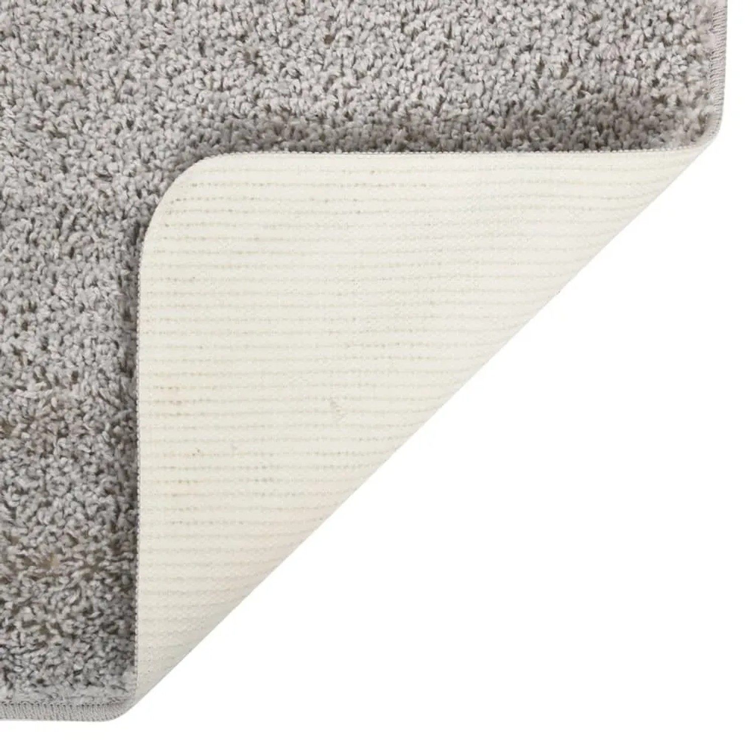Hellgrauer Shaggy Teppich (80x150 cm) mit rutschfester Unterseite.