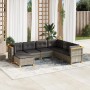 Graue 7-teilige Garten-Sofagarnitur aus Polyrattan mit dunklen Kissen.
