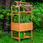 Dobar Pflanzturm-Aufsatz Magic Kubus 2.0, bernsteinfarben, mit Pflanzen und Deko im Garten.
