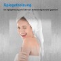 Frau mit Handtuch vor beschlagenem Badspiegel mit Spiegelheizung.
