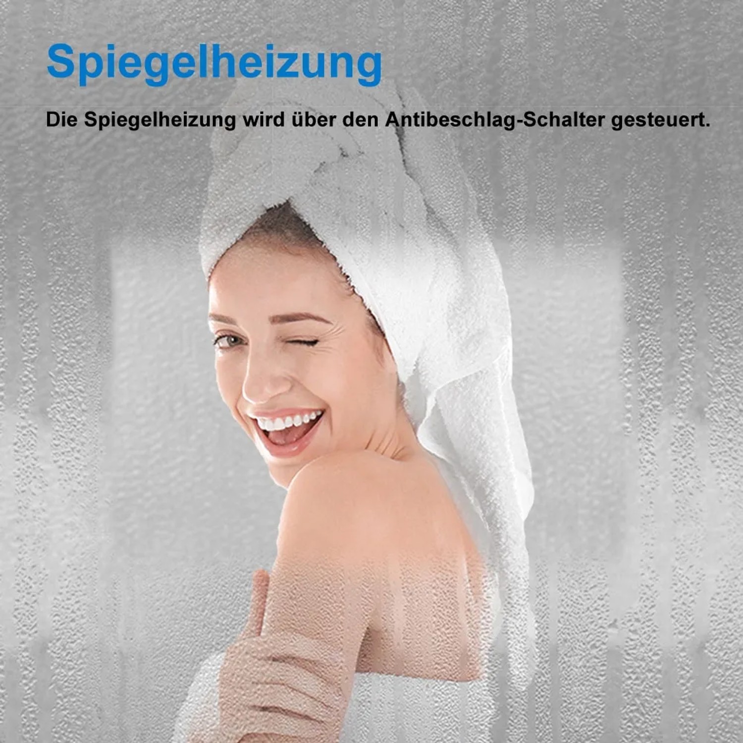 Frau mit Handtuch vor beschlagenem Badspiegel mit Spiegelheizung.