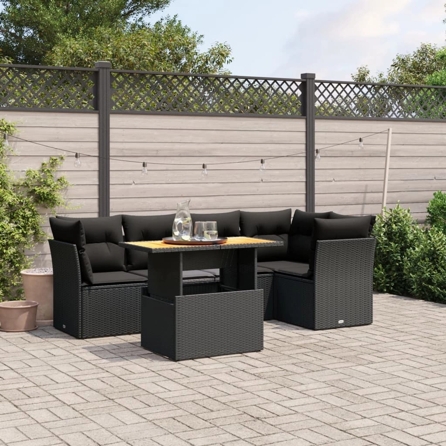 Schwarze 5-tlg. vidaXL Garten-Sofagarnitur aus Poly Rattan mit Tisch und Kissen.