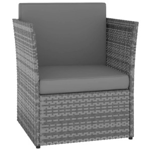 Anthrazitfarbener Furnicato Gartensessel mit Hocker aus Polyrattan mit grauen Polstern.