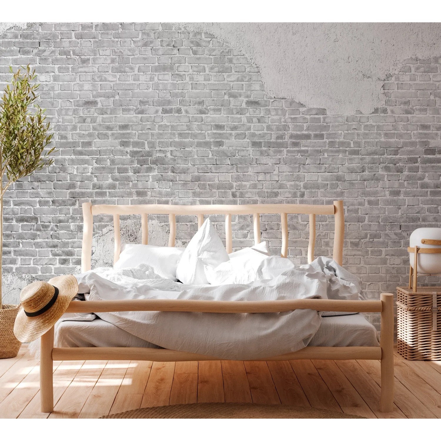 Fototapete Steinwand Klinker Putz in Weiß hinter einem Bett im Industrial Stil.