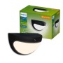 Schwarze Philips Solar-Wandleuchte Swyn für den Außenbereich, mit Bewegungssensor und warmweißem Licht.