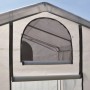 Detailansicht Foliengewächshaus mit aufgerolltem Fenster zur Belüftung.