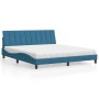 Blaues Samt Bett mit Matratze (180x200 cm) und wellenförmigem Design.