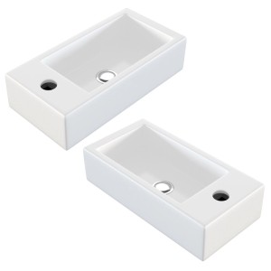 Zwei weiße, kompakte NEG Uno41H Hänge-Waschbecken aus Keramik für Wandmontage, mit Hahnloch links und rechts.