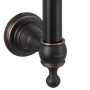 PaulGurkes Duschsystem Nostalgie Schwarz: Detail der antiken Wandhalterung aus dunklem Messing mit dekorativen Elementen und Logo.