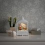 Weiße LED-Wasserlaterne mit Weihnachtsmann und Elch für stimmungsvolle Weihnachtsdeko im Innenbereich.