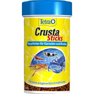 Tetra Crusta Sticks 100ml: Hauptfutter für Garnelen und Krebse im gelben Behälter mit blauen Deckel.