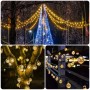Salcar Solar LED Lichterkette mit 40 warmweißen Kristalllampen dekoriert Bäume und Geländer im Garten.