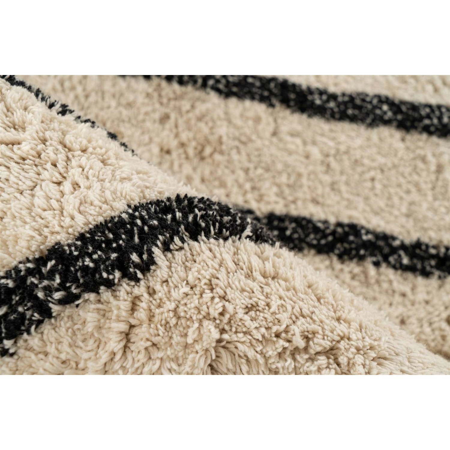 Detailansicht: Moderner Kurzflor Teppich in Creme und Schwarz mit Baumwollanteil.