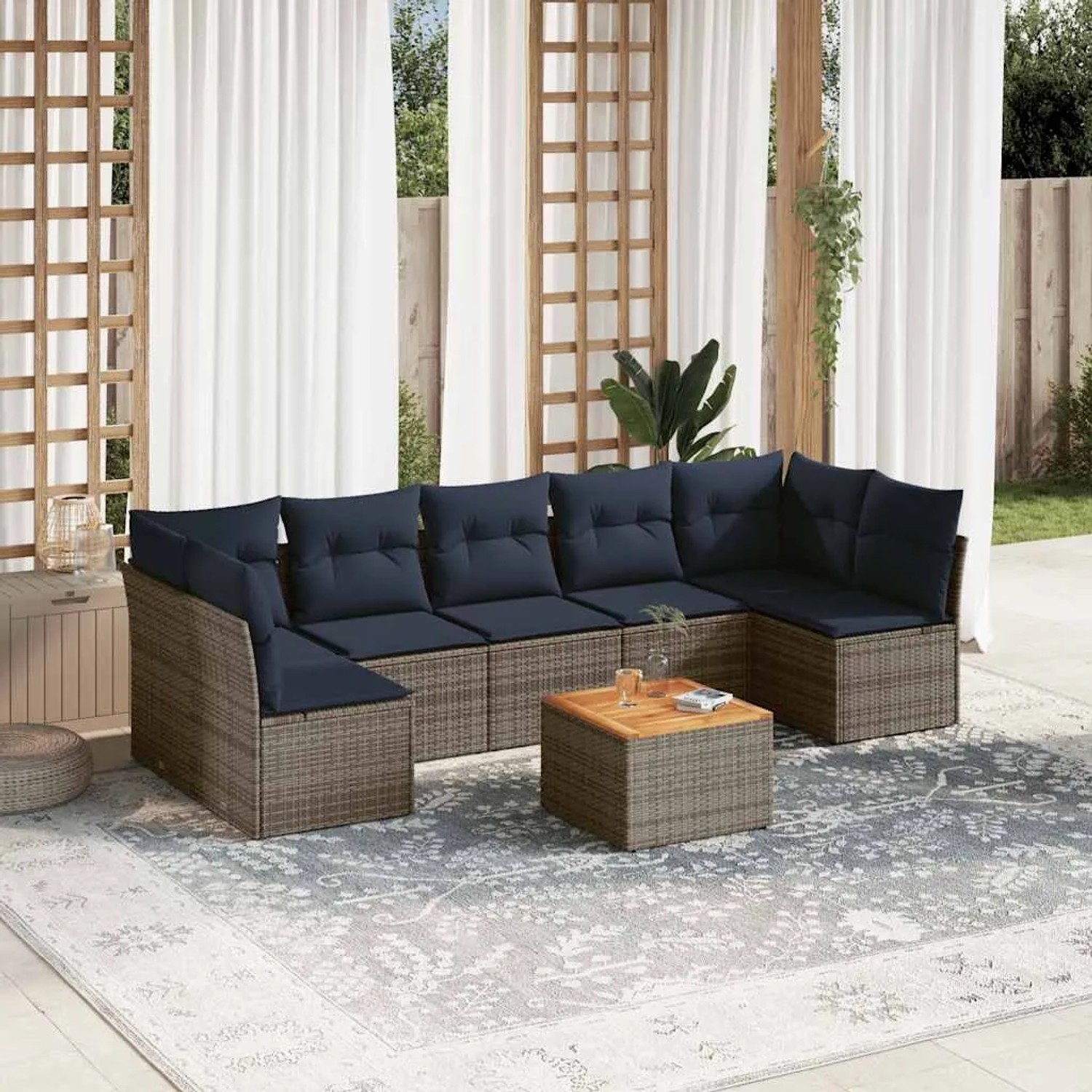 Graue 8-tlg. vidaXL Garten-Sofagarnitur aus Rattan mit marineblauen Kissen und Tisch.