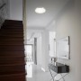 Briloner LED-Deckenleuchte Simpa, Alu-weiß, mit Backlighteffekt im Flur.