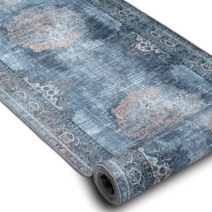 RugsX Lotus Läufer, grau-blau mit abstraktem Muster, teilweise gerollt. Rutschfester Polyester-Teppich, maschinenwaschbar.