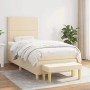 Cremefarbenes Boxspringbett (100x200 cm) mit Matratze und Bank. Stoffbezug.