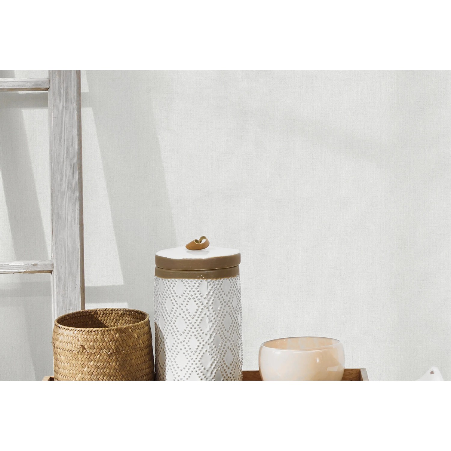 A.S. Création Vliestapete Uni Textiloptik Grau-Weiß an Wand, dezente Struktur.