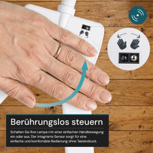LUXULA LED Schreibtischlampe: Hand steuert Lampe berührungslos per Sensor.