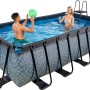 Grauer EXIT Stone Pool 400x200 mit Sandfilterpumpe und Poolleiter im Garten.