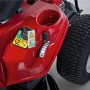 Detailaufnahme: Roter Troy-Bilt Aufsitzmäher Mini-Rider 76T-S mit Seitenauswurf, Bedienelemente und Reifen im Fokus.