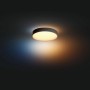 Schwarze Philips Hue Enrave M Deckenleuchte mit Dimmer und warmweißem Licht.