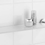 Wenko Glas Wandablage Bosio aus Edelstahl, mit Pflegeprodukten auf weißen Fliesen.