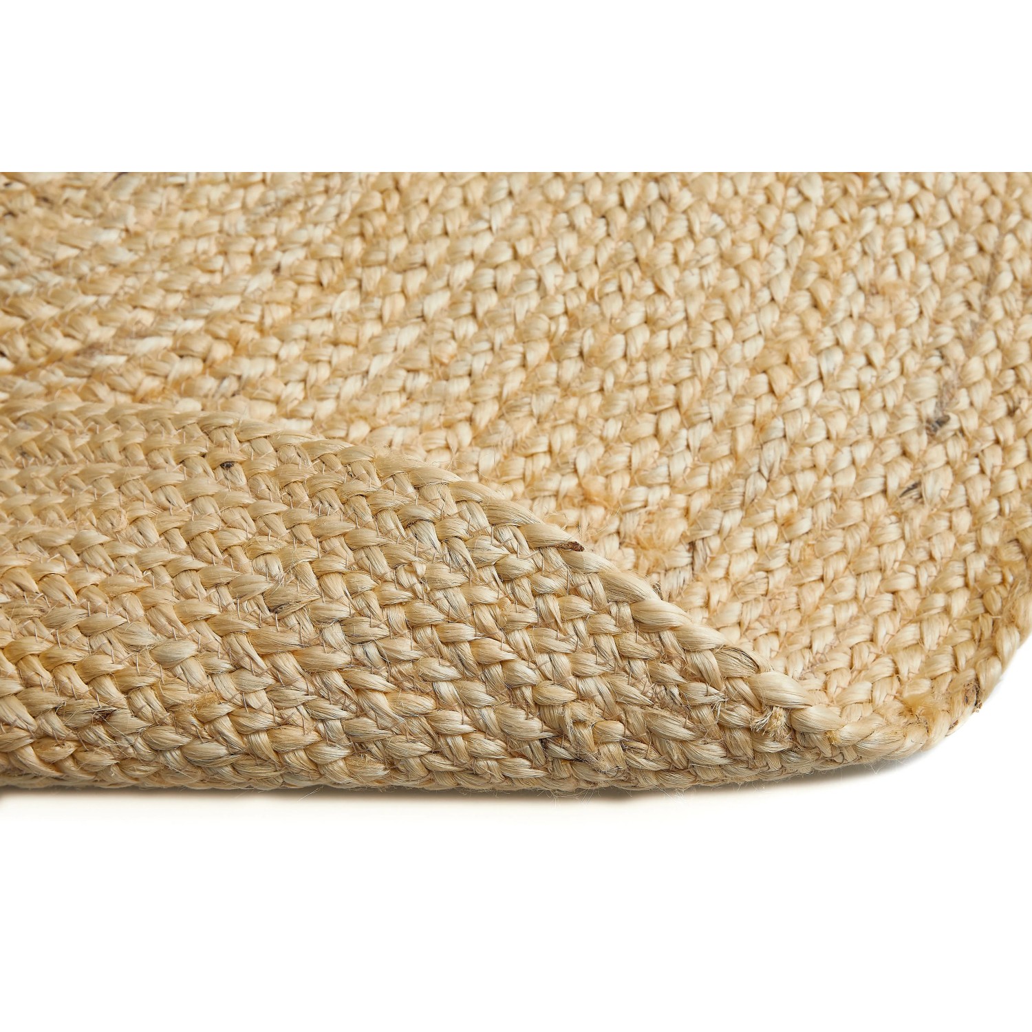 Detailansicht des runden, creme-farbenen Teppichs Luxor Living Ivo Ø 60 cm aus Jute, geflochten.