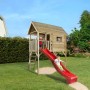 Weka Stelzen-Spielhaus Tabaluga mit roter Wellenrutsche im Garten, Kinder spielen.