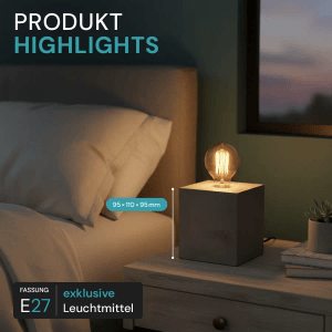 Graue LUXULA Tischleuchte mit E27 Fassung auf Nachttisch. Modernes, minimalistisches Metall-Design als Dekoleuchte.