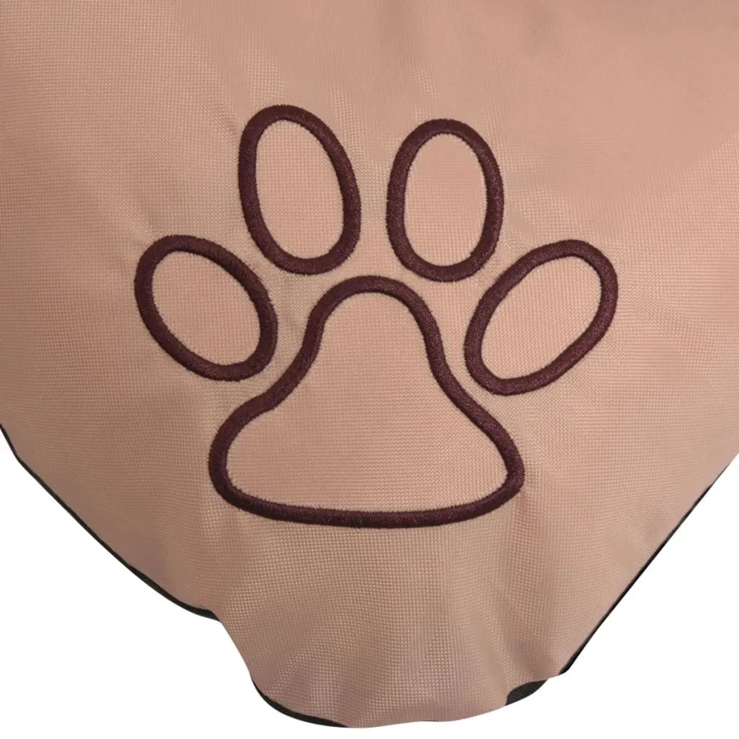 Detailansicht: Beiges Hundebett XXL mit braunem Pfotenabdruck.