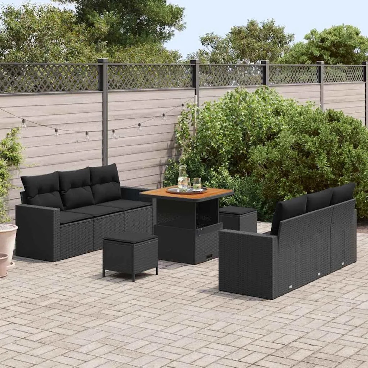 Schwarzes 9-teiliges vidaXL Garten-Sofa-Set aus Poly Rattan mit höhenverstellbarem Tisch.