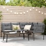 Schwarze vidaXL Garten-Sofagarnitur mit Kissen und Tisch auf einer Terrasse.