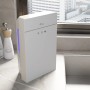 Weißer TroniTechnik Luftentfeuchter EF03 mit 2,2L Tank und Glasfront auf einer Küchentheke.
